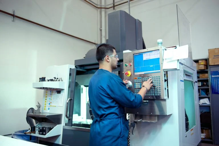 Operator Controlling a CNC Machining Operation