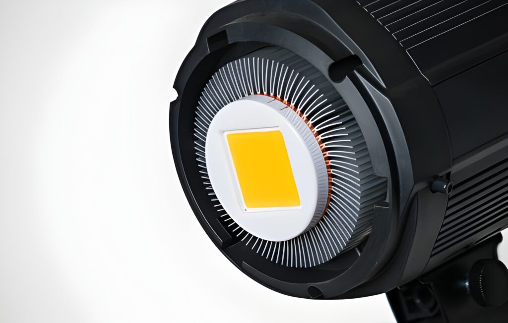Yellow LED module in a photographic reflector with aluminum cooling fins