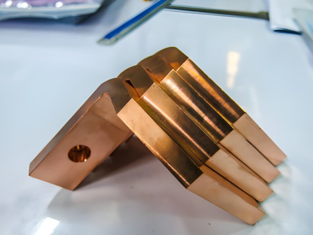 Copper parts with a drilled hole